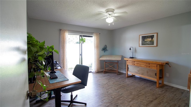 office space with dark hardwood / wood-style floors, a textured ceiling, and ceiling fan