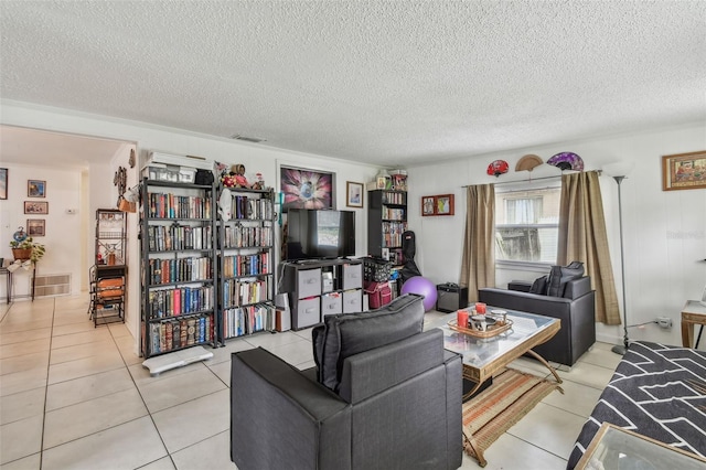 tiled living room with a textured ceiling