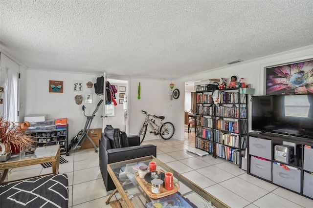 living room with light tile patterned floors and a textured ceiling