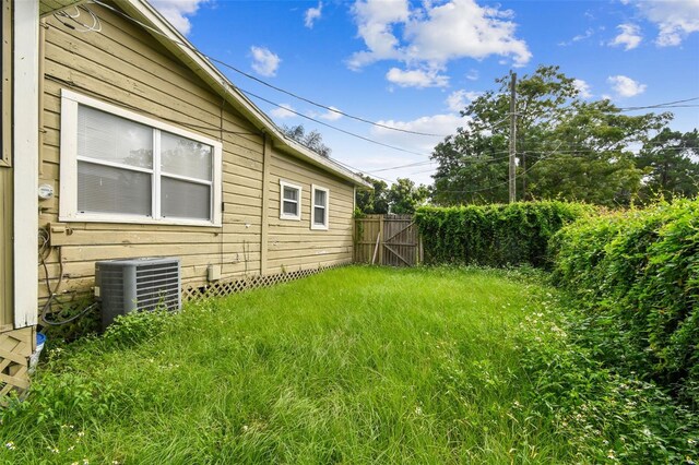 view of yard with central AC