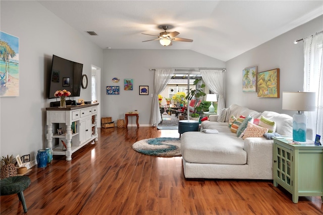 living room featuring ceiling fan, wood-type flooring, and vaulted ceiling