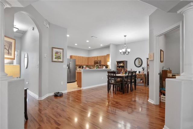 dining room featuring light hardwood / wood-style floors and an inviting chandelier