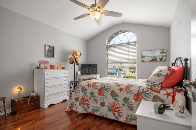 bedroom featuring dark hardwood / wood-style floors, vaulted ceiling, and ceiling fan