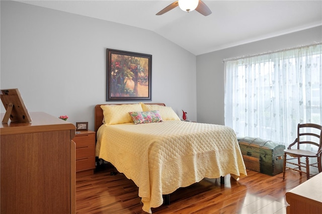 bedroom featuring dark hardwood / wood-style floors, ceiling fan, and lofted ceiling