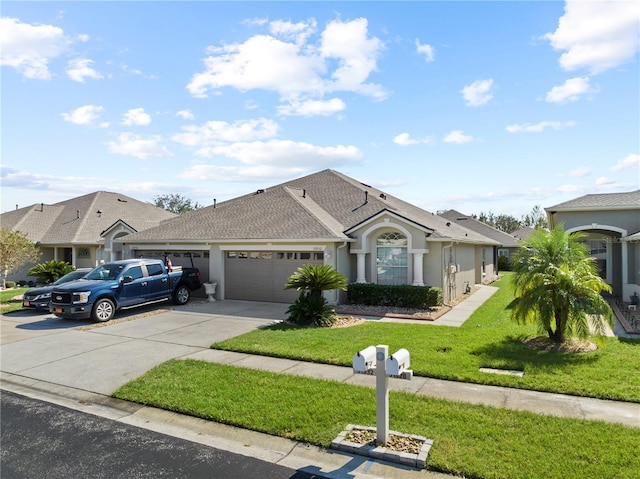 single story home featuring a garage and a front lawn