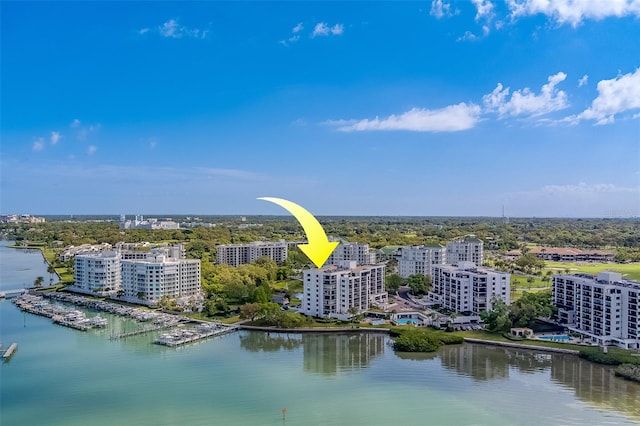 birds eye view of property with a water view