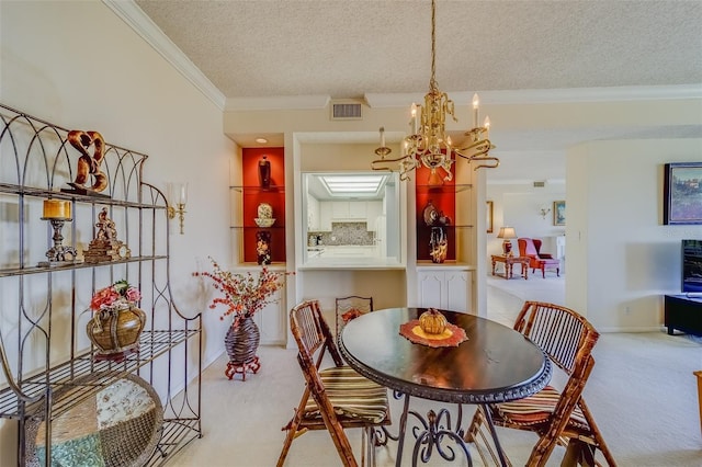 carpeted dining room featuring crown molding, a notable chandelier, and a textured ceiling