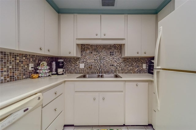 kitchen featuring white cabinets, white appliances, sink, and backsplash