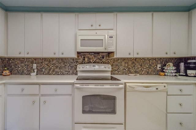 kitchen with backsplash, white appliances, and white cabinets