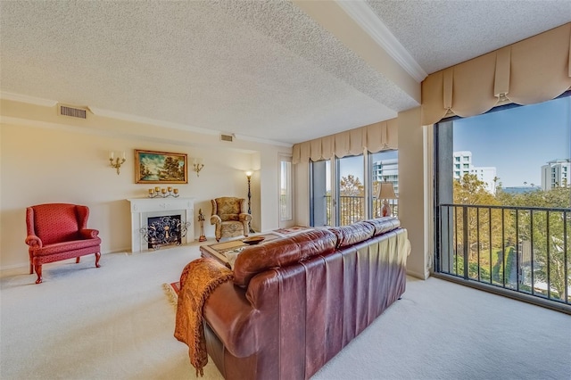 living room featuring light colored carpet, ornamental molding, and a textured ceiling