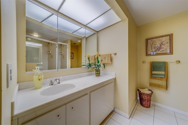 bathroom featuring tile patterned floors, vanity, and an enclosed shower