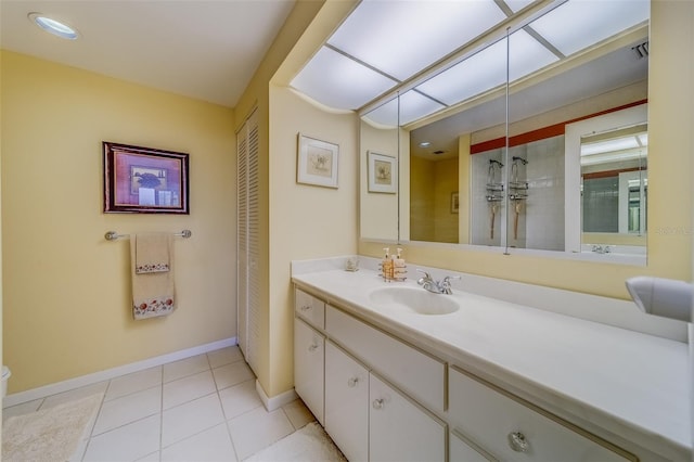 bathroom with vanity and tile patterned flooring