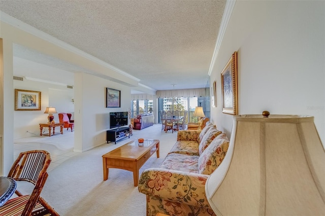 living room featuring ornamental molding, light carpet, and a textured ceiling