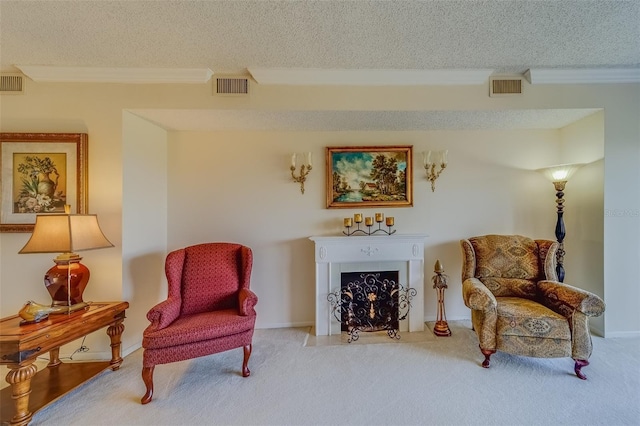 living area featuring crown molding, light colored carpet, and a textured ceiling