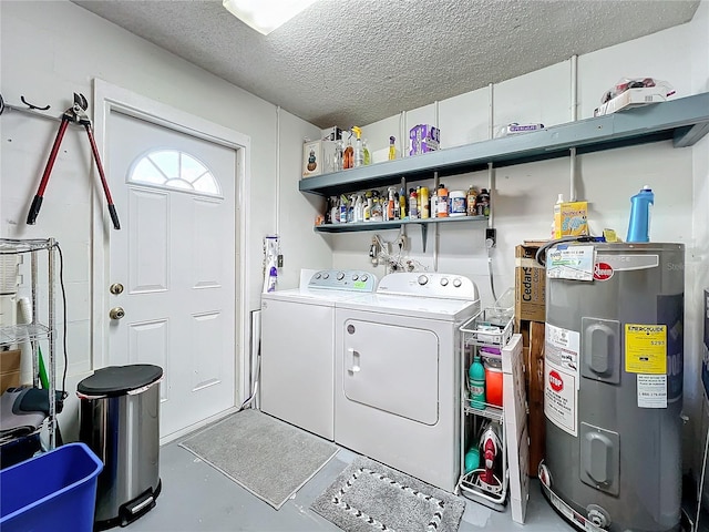 washroom with independent washer and dryer, electric water heater, and a textured ceiling