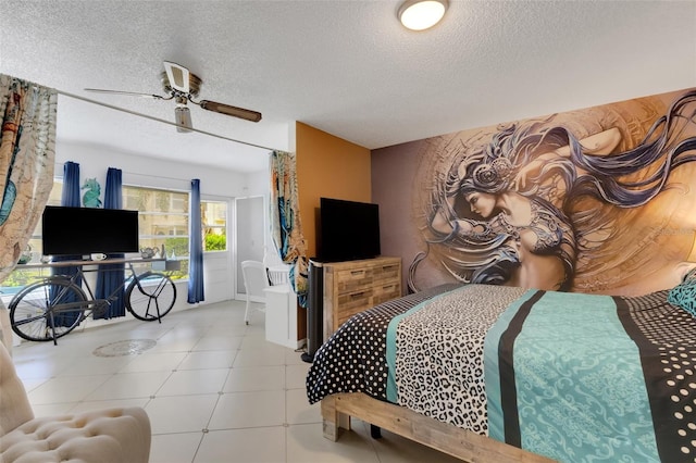 tiled bedroom featuring ceiling fan and a textured ceiling