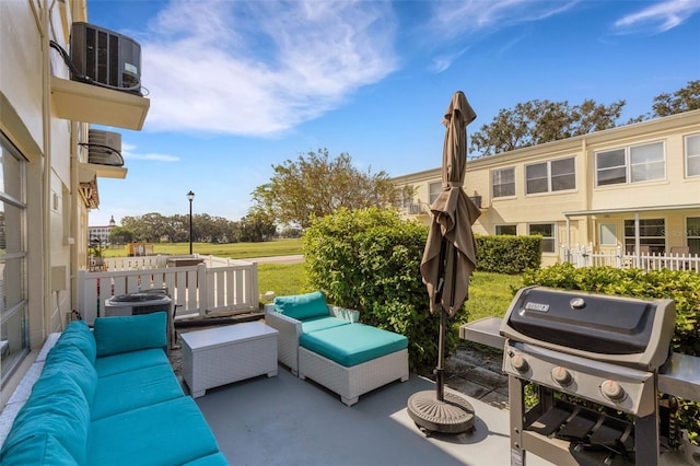 view of patio / terrace with an outdoor living space and a grill