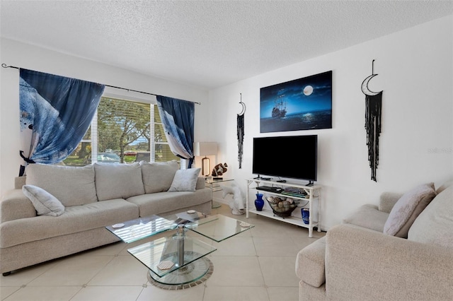 living room with tile patterned floors and a textured ceiling