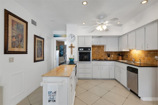 kitchen with white cabinetry, black oven, a textured ceiling, dishwasher, and sink