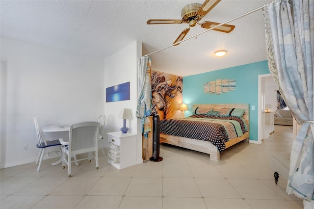 bedroom featuring ceiling fan and a textured ceiling