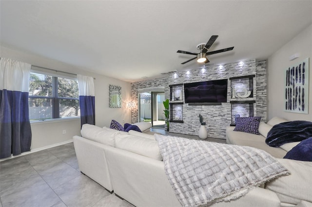 living room with tile patterned flooring and ceiling fan