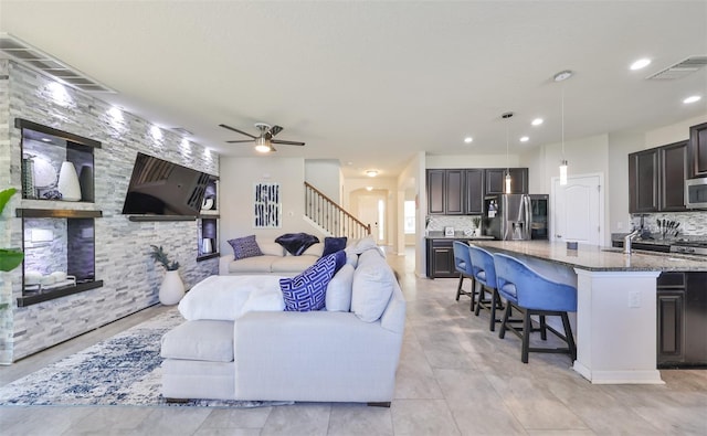 living room with ceiling fan