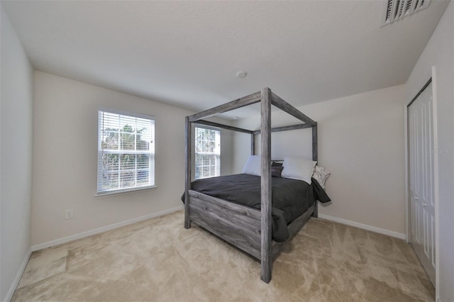 carpeted bedroom featuring a closet