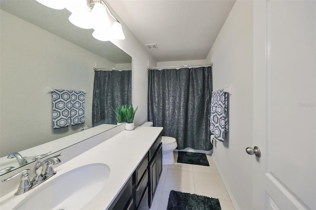 bathroom featuring vanity, toilet, curtained shower, and tile patterned flooring