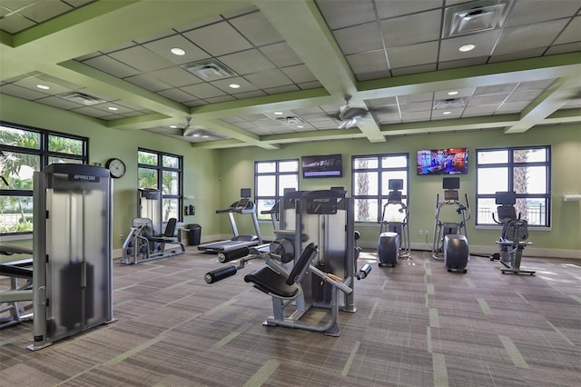 workout area featuring light carpet and coffered ceiling