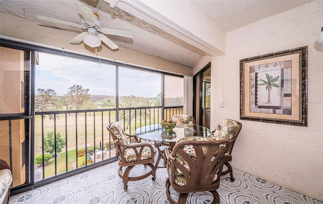 sunroom / solarium with ceiling fan