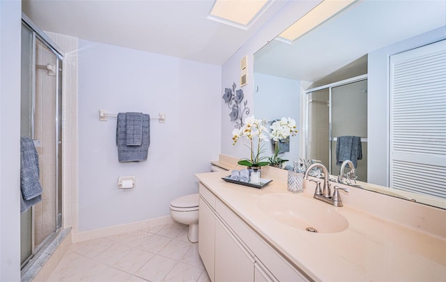 bathroom featuring a shower with shower door, vanity, toilet, and lofted ceiling with skylight