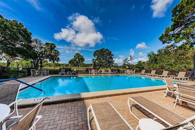 view of swimming pool featuring a patio area