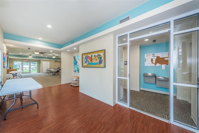 hallway featuring hardwood / wood-style flooring