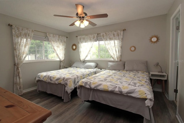 bedroom featuring dark wood-type flooring and ceiling fan