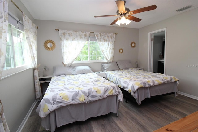 bedroom featuring ceiling fan and dark hardwood / wood-style flooring