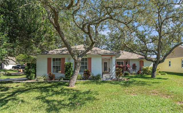 ranch-style house with a front lawn