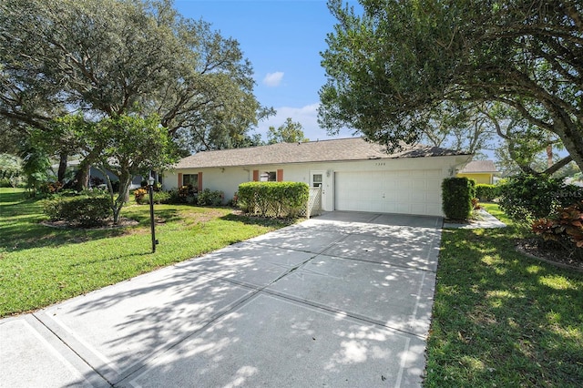 ranch-style home featuring a front yard and a garage