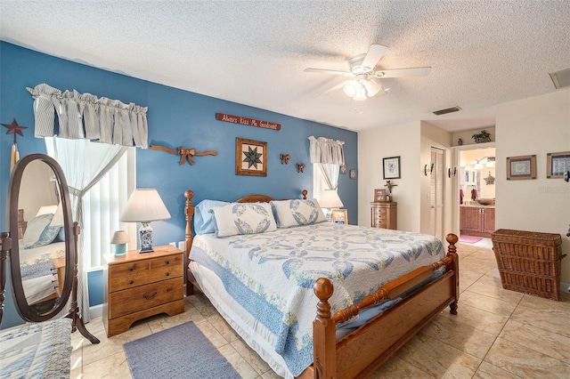 bedroom with a closet, ensuite bathroom, a textured ceiling, and ceiling fan