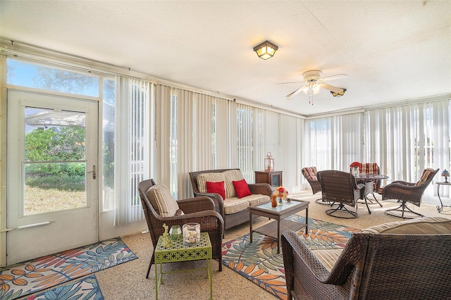 sunroom featuring ceiling fan