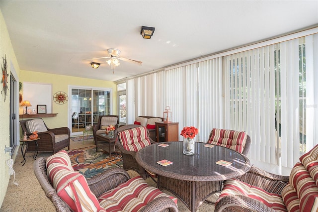 sunroom / solarium with ceiling fan and plenty of natural light