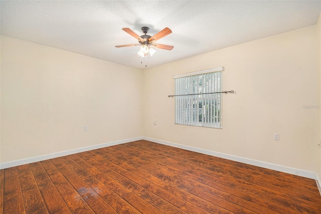 unfurnished room featuring ceiling fan, dark hardwood / wood-style floors, and a textured ceiling