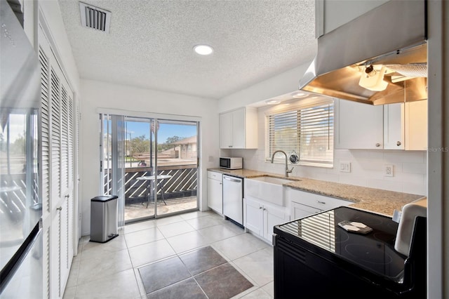 kitchen with black / electric stove, backsplash, dishwasher, and white cabinets