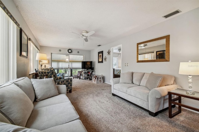 4028 Davit Dr Unit 4028, New Port Richey, FL 34652 - carpeted living area with a ceiling fan and a textured ceiling
