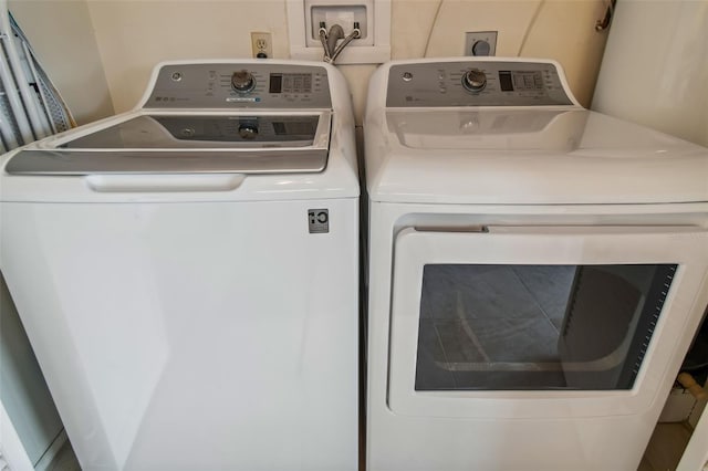 laundry room featuring washing machine and dryer