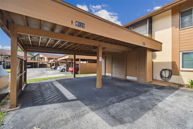 view of vehicle parking featuring a carport