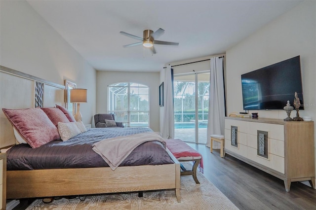 bedroom with hardwood / wood-style flooring, access to outside, and ceiling fan