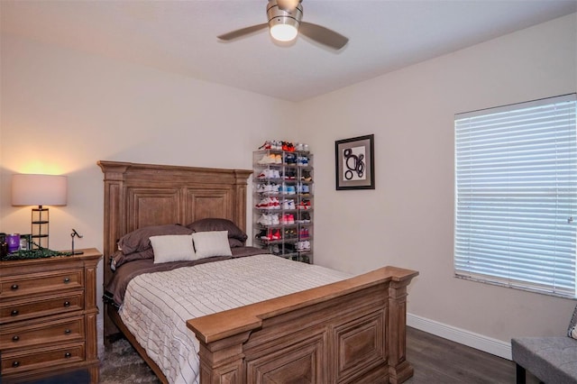 bedroom featuring ceiling fan and dark hardwood / wood-style flooring