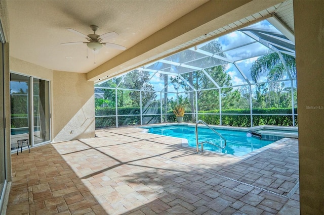 view of pool featuring ceiling fan, a lanai, and a patio