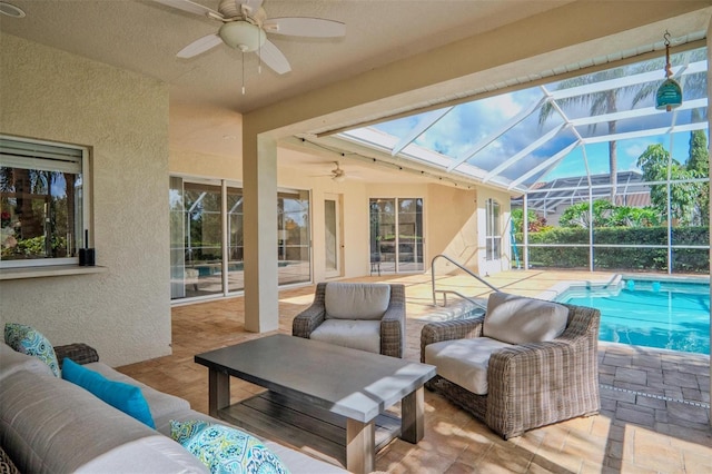 exterior space with ceiling fan, an outdoor living space, and glass enclosure