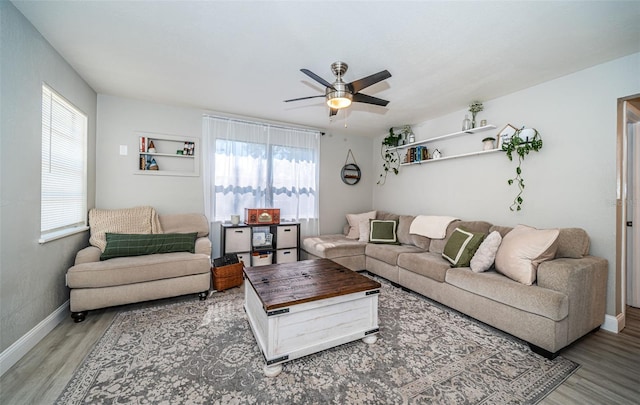 living room with ceiling fan, hardwood / wood-style flooring, and a wealth of natural light